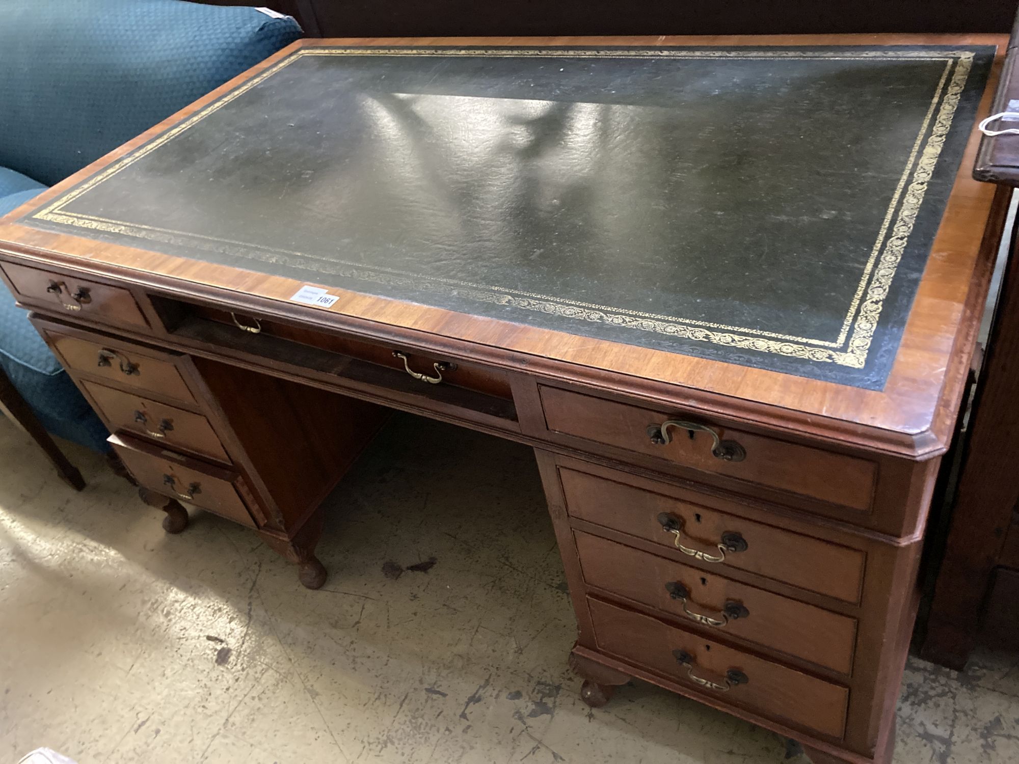 A George III style walnut pedestal desk, fitted nine small drawers, width 154cm, depth 92cm,