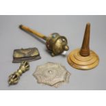 A Tibetan brass prayer wheel, inset with cabochons, with turned wood handle and four other items,