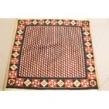 A 19th century 'Crimean' patchwork cover, made from military uniform felt in red, white, black and