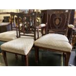 A pair of Edwardian inlaid mahogany elbow chairs and a matching single chair (3)