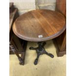 A Victorian style cast iron circular mahogany topped table, 58cm diameter, height 72cm