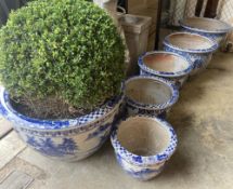 A graduated set of six Chinese style blue and white circular planters, largest width 70cm, height