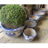 A graduated set of six Chinese style blue and white circular planters, largest width 70cm, height