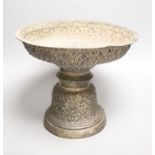 A late 19th/early 20th century Burmese? repousse white metal pedestal bowl(a.f.), height 24cm, gross