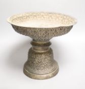 A late 19th/early 20th century Burmese? repousse white metal pedestal bowl(a.f.), height 24cm, gross