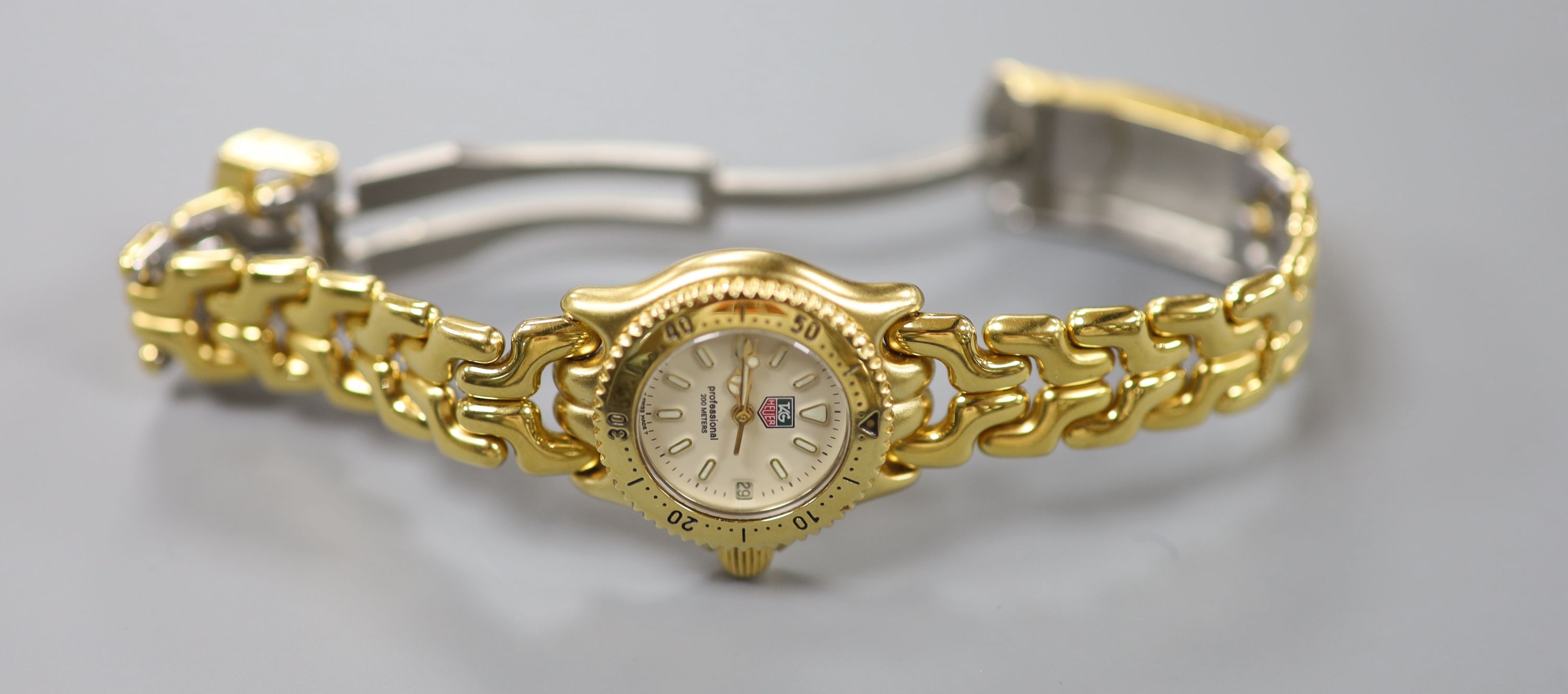 A lady's modern gilt steel Tag Heuer Professional quartz wrist watch, cased diameter 23mm, ex. - Image 2 of 4