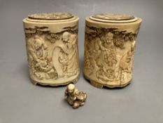 A pair of 19th century Chinese finely carved ivory lidded pots, 12.5cm high and Japanese