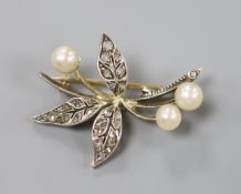 An early 20th century yellow and white metal, cultured pearl and rose cut diamond set floral spray