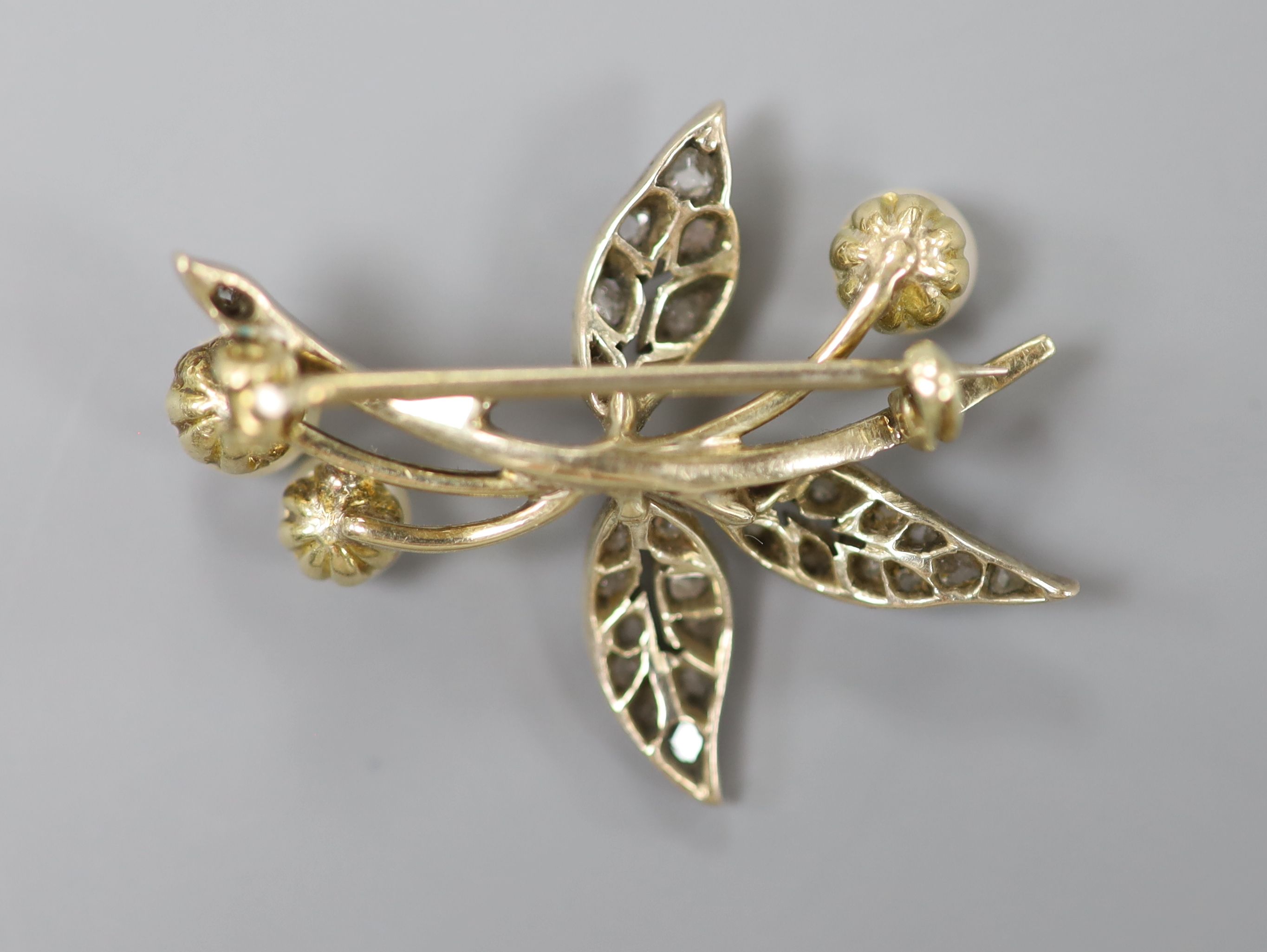 An early 20th century yellow and white metal, cultured pearl and rose cut diamond set floral spray - Image 2 of 2