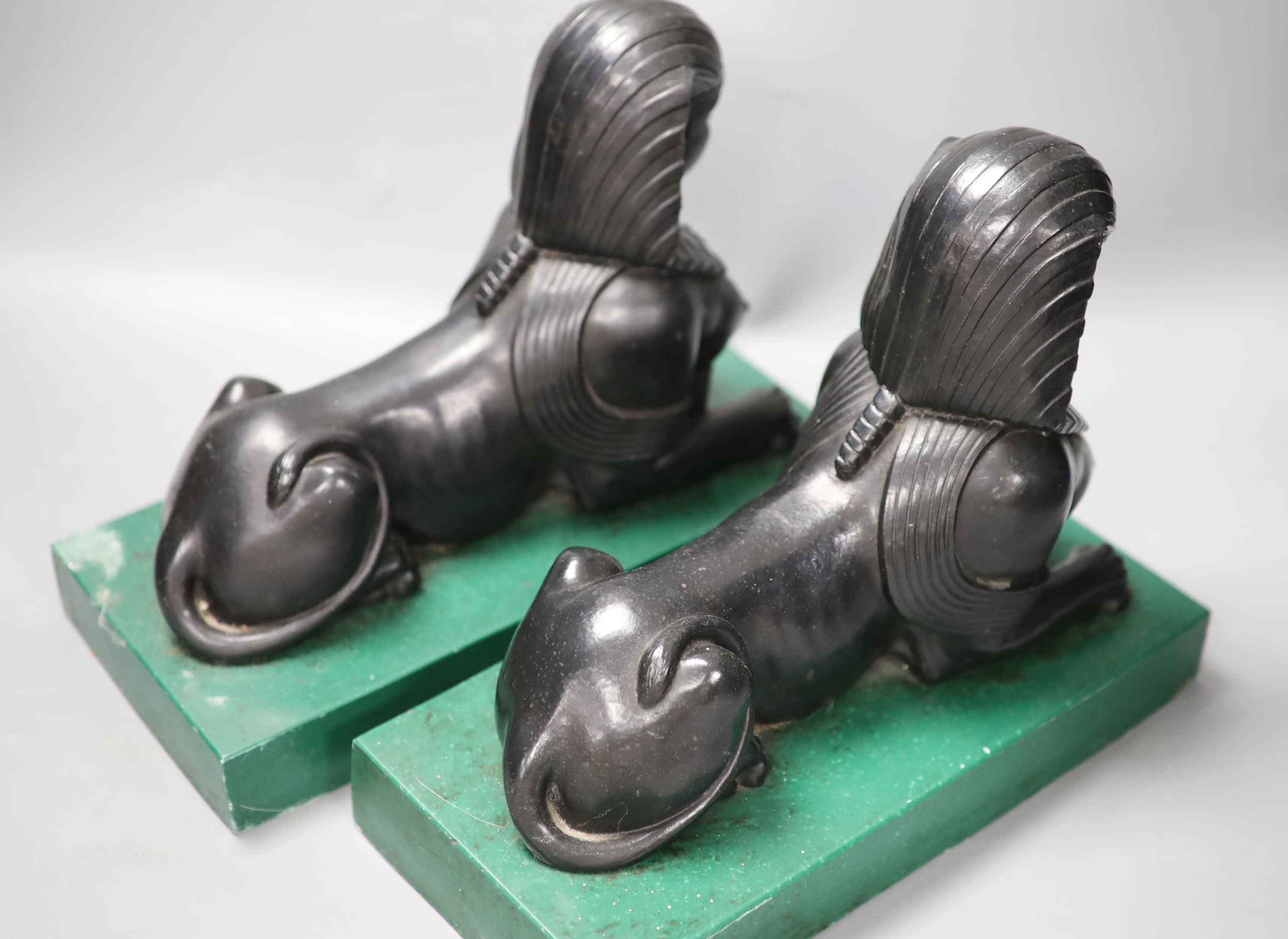A pair of Egyptianesque composition bookends, each modelled as a Sphinx, width 28cm height 23cm - Image 3 of 3