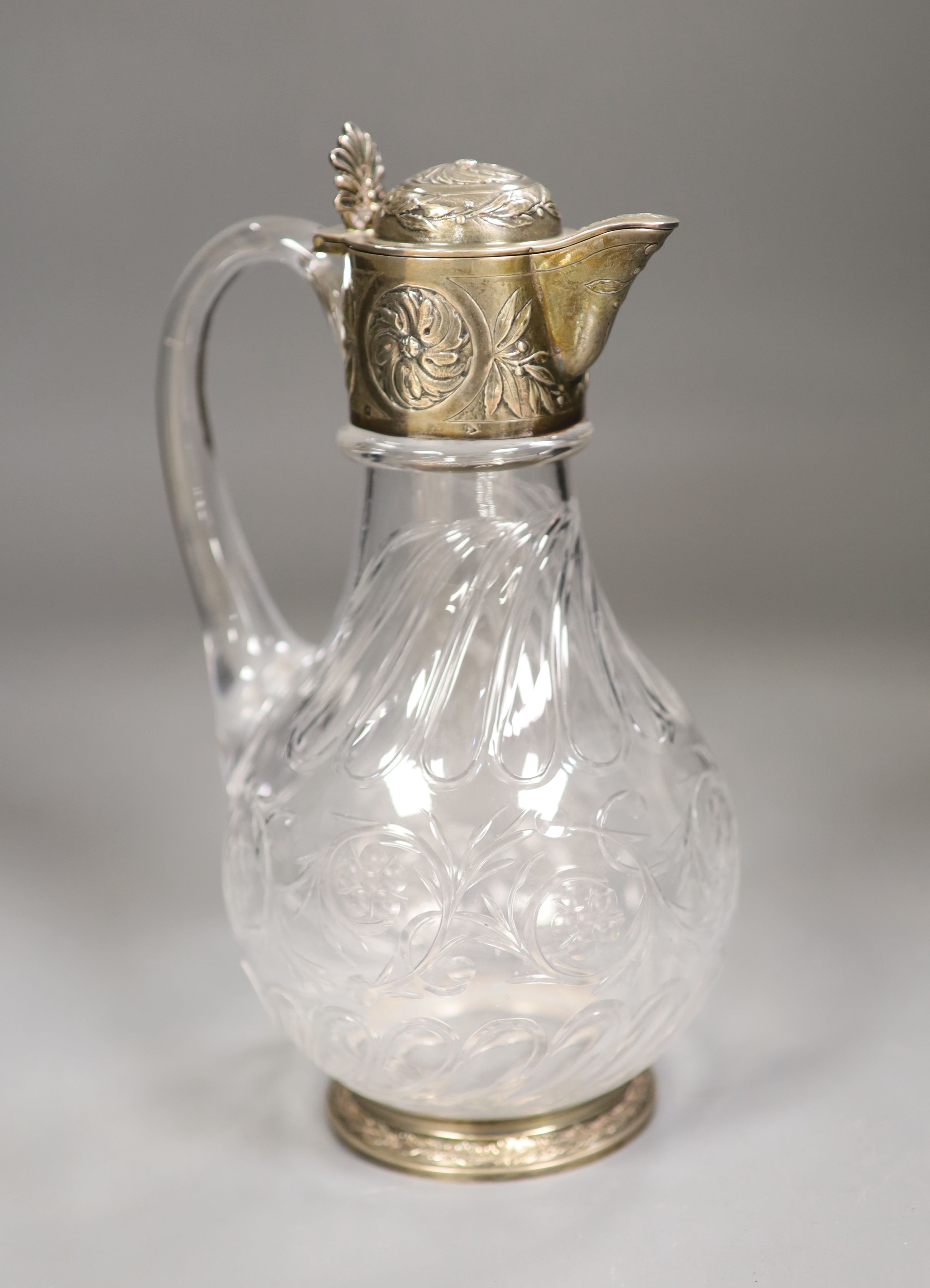 An early 20th century French white metal mounted glass claret jug, maker AL, height 23cm.