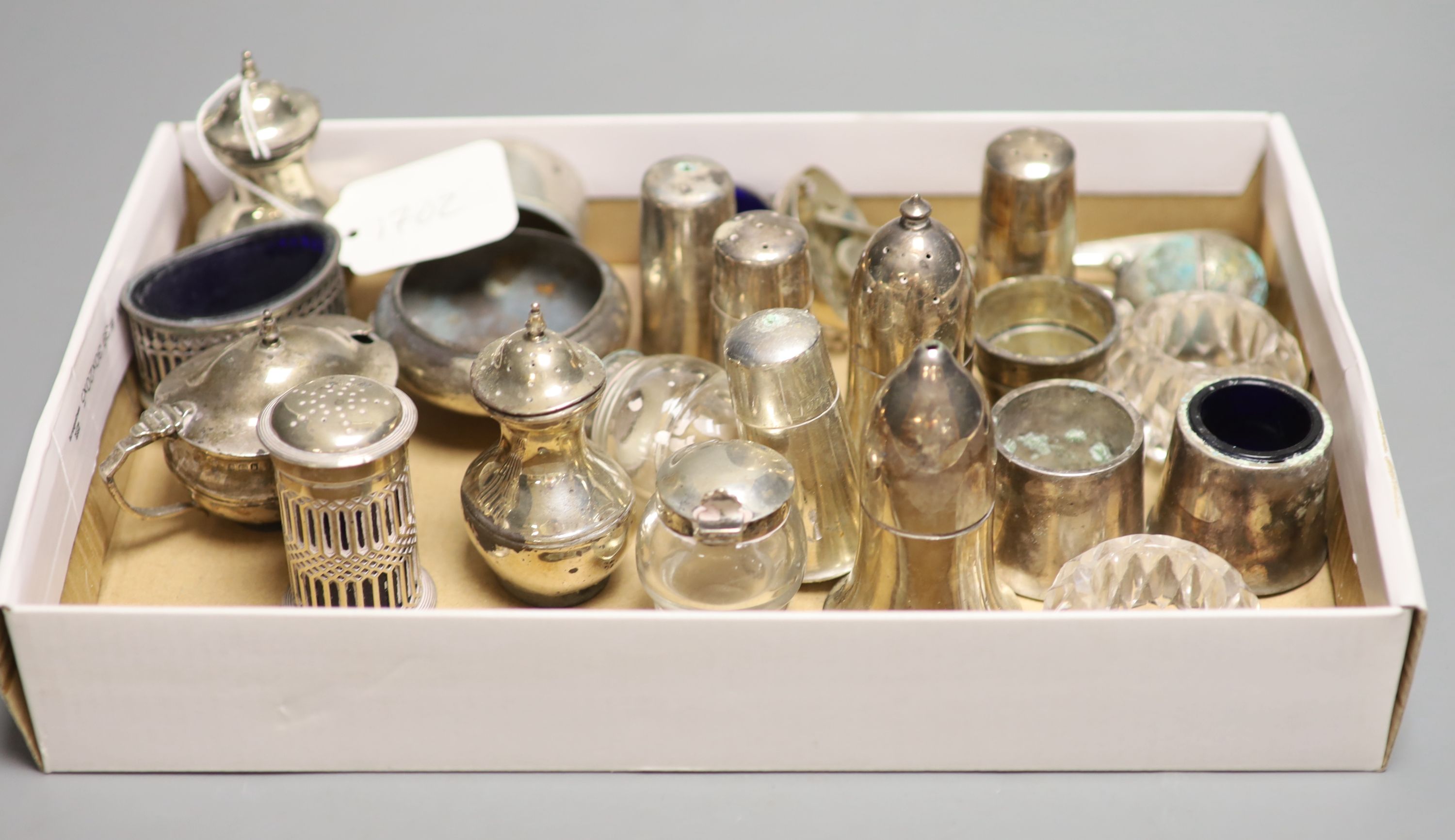 Eight assorted silver condiments including pair of Victorian mounted glass and a Georgian bun