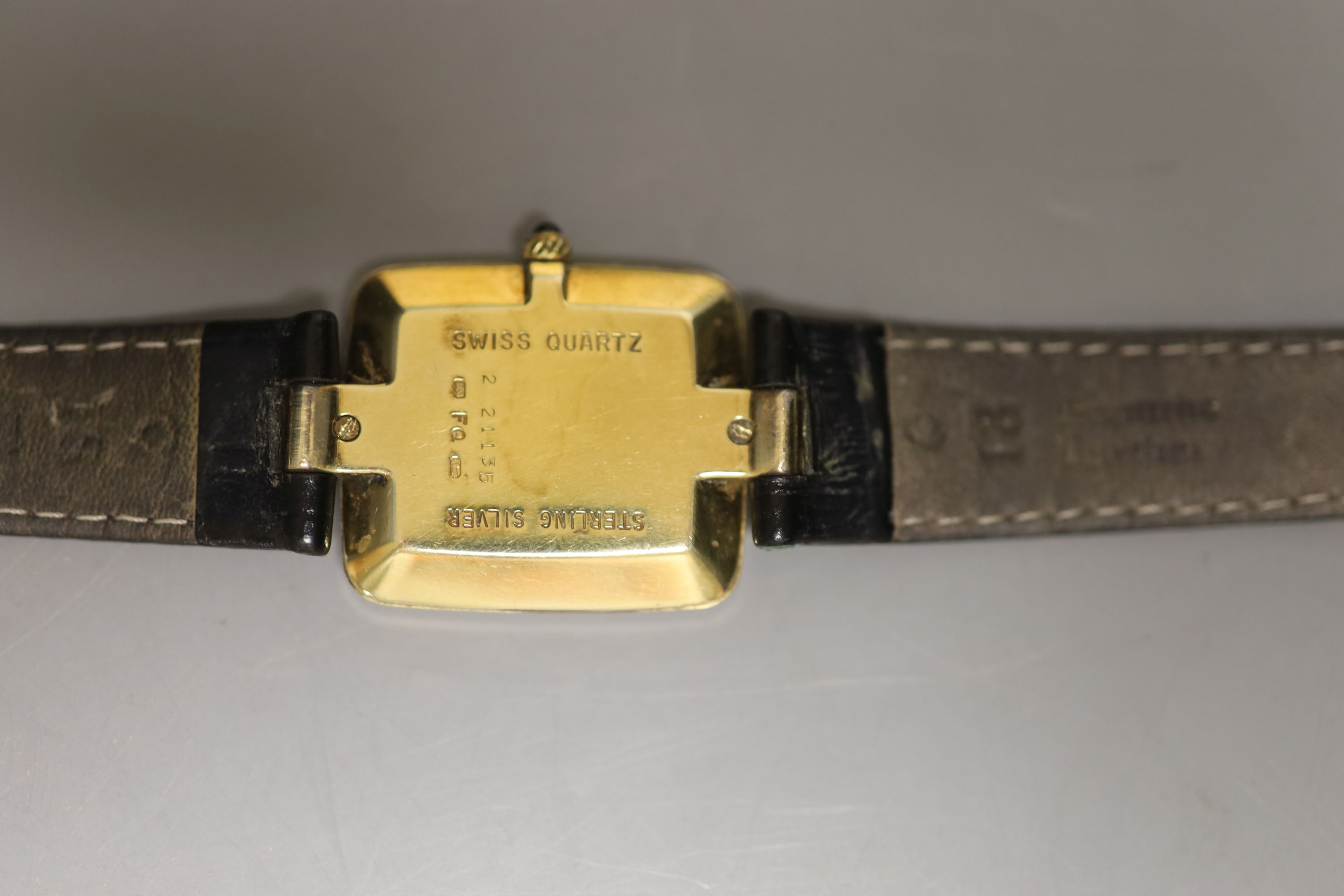 A gentleman's silver gilt Dunhill quartz shaped rectangular dial wrist watch, on a leather strap - Image 3 of 3