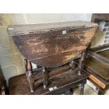 A small 18th century oak oval-topped gateleg table, width 83cm, length 96cm extended, height 62cm