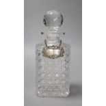 A George IV silver Whiskey label by John Riley 1824 and a cut glass decanter, height 24cm