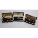 Three assorted Edwardian and later yellow metal bar brooches including a sapphire and seed pearl,