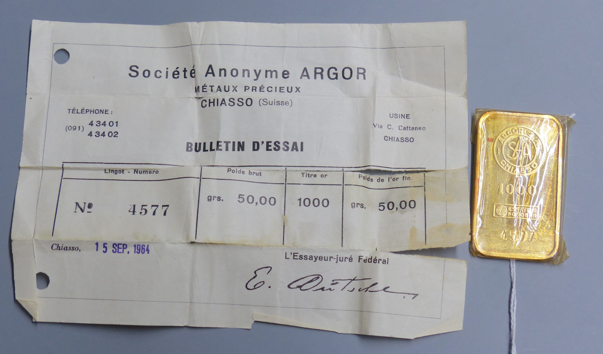 A Swiss Argor S.A. Chiasso '1000' yellow metal ingot, numbered 4577, weighing 50 grams, with