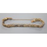 A 10ct yellow metal gatelink bracelet, approx. 16.5cm, 9.6 grams.