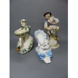 A French porcelain cherub 'shoe', a Continental porcelain cherub and swan dish and group of a