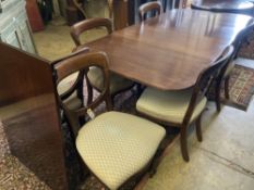 A George III style mahogany twin pillar extending dining table, extended 270cm (one spare leaf),
