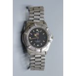 A gentleman's modern stainless steel Tag Heuer Professional quartz wrist watch, on stainless steel