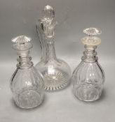 A pair of early 19th century cut glass decanters, height 24cm and an Edwardian claret jug, height