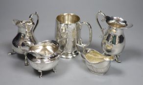 A Victorian engraved silver footed Christening mug, Edward Hutton, London, 1886 and four silver