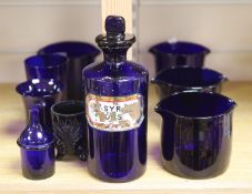 A collection of Bristol blue glass including rinsers, a drug jar, etc., tallest 24cm