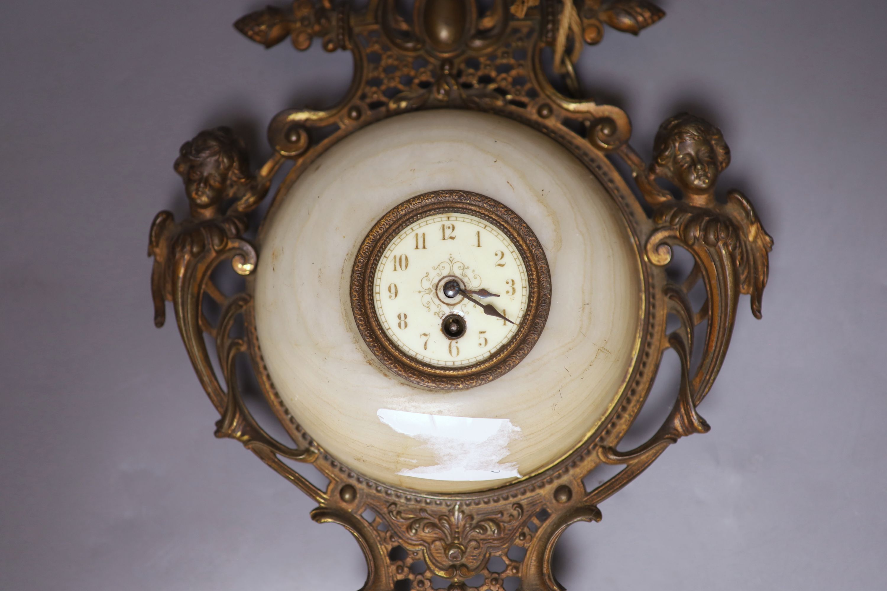 A French gilt metal, onyx and enamelled wall clock, length 49cm - Image 2 of 4