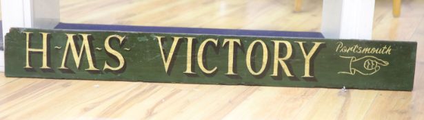 An HMS Victory, Portsmouth painted wood sign, length 120cm