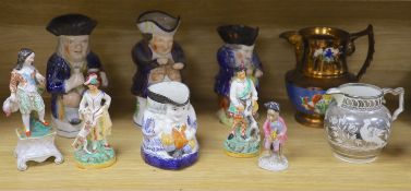 A quantity of Staffordshire pottery, including four Toby jugs, four figures, a copper lustre jug and