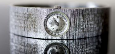 A lady's 1970's? textured stainless steel Girard Perregaux manual wind bracelet wrist watch, approx.
