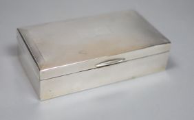 A 1960's engine turned silver mounted rectangular cigarette box, with engraved initials, 15.9cm,