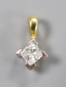 A modern 18ct gold and solitaire princess cut diamond set pendant, overall 7mm, gross 0.9 grams.