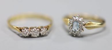 A yellow metal and three stone diamond ring, size Q, gross 1.7 grams and a modern 9ct gold,