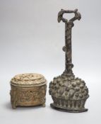 A Victorian black painted cast iron door stop, height 36cm, and a Victorian cast copper lidded