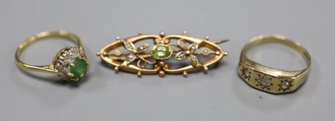 An 18ct, green stone(worn) and diamond cluster set dress ring, size R, gross 4 grams, a 9ct gold