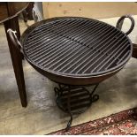 A wrought iron fire pit, 56cm diameter, height 64cm