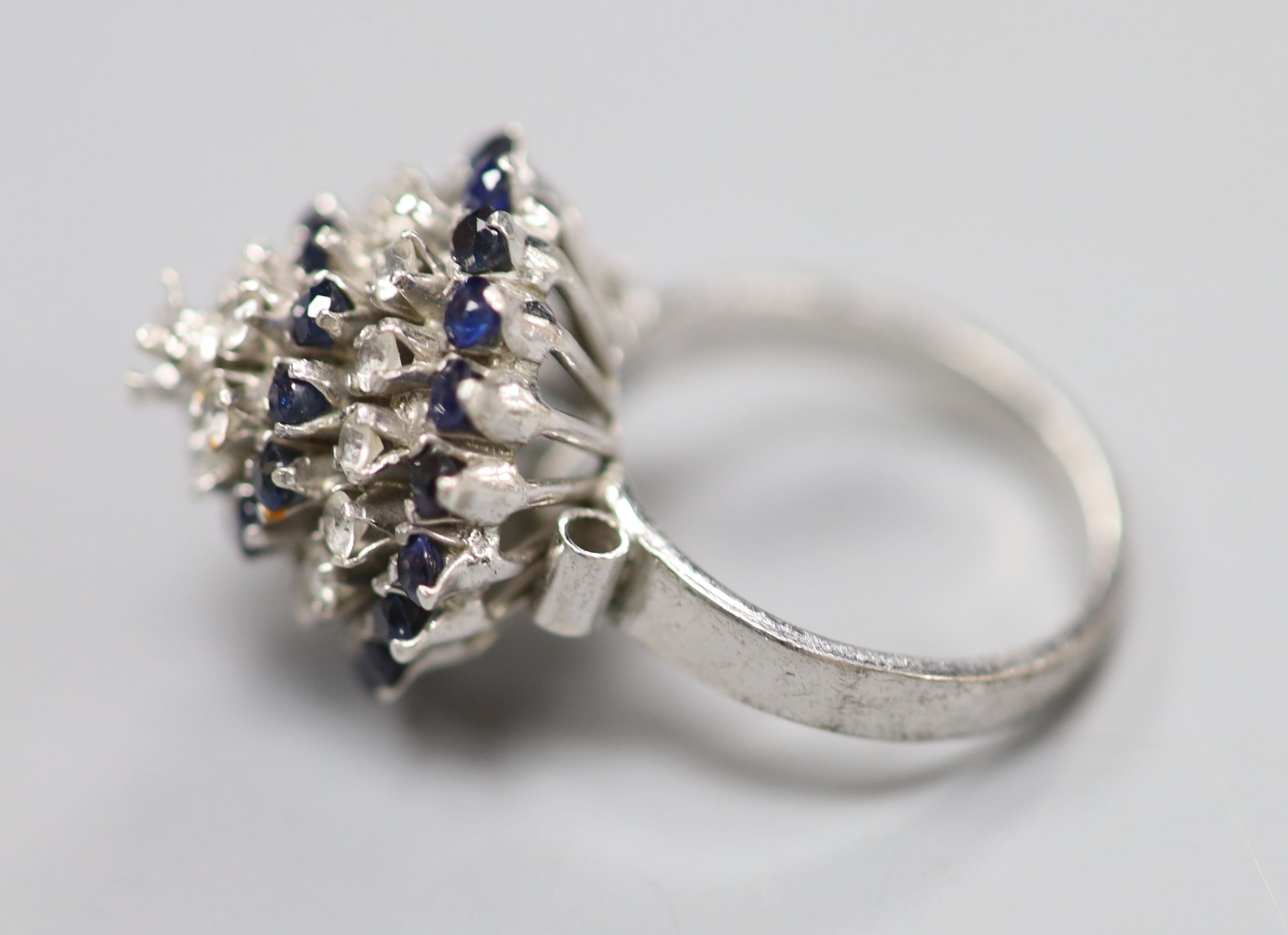 A white metal (stamped 18k) and two colour sapphire? set raised cluster ring, size K/L, gross 5.2 - Image 2 of 3