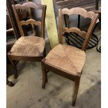 A set of four 19th century French beech rush seat dining chairs