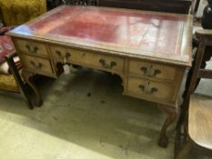 A Queen Anne revival mahogany kneehole desk, length 122cm, depth 76cm, height 76cm