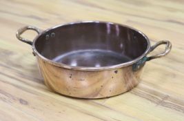 A Victorian copper preserve pan, stamped Benet Fink and Co., Cheapside, 51cm handle to handle