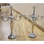 A pair of plated and glass four branch five light candelabra, height 68cm