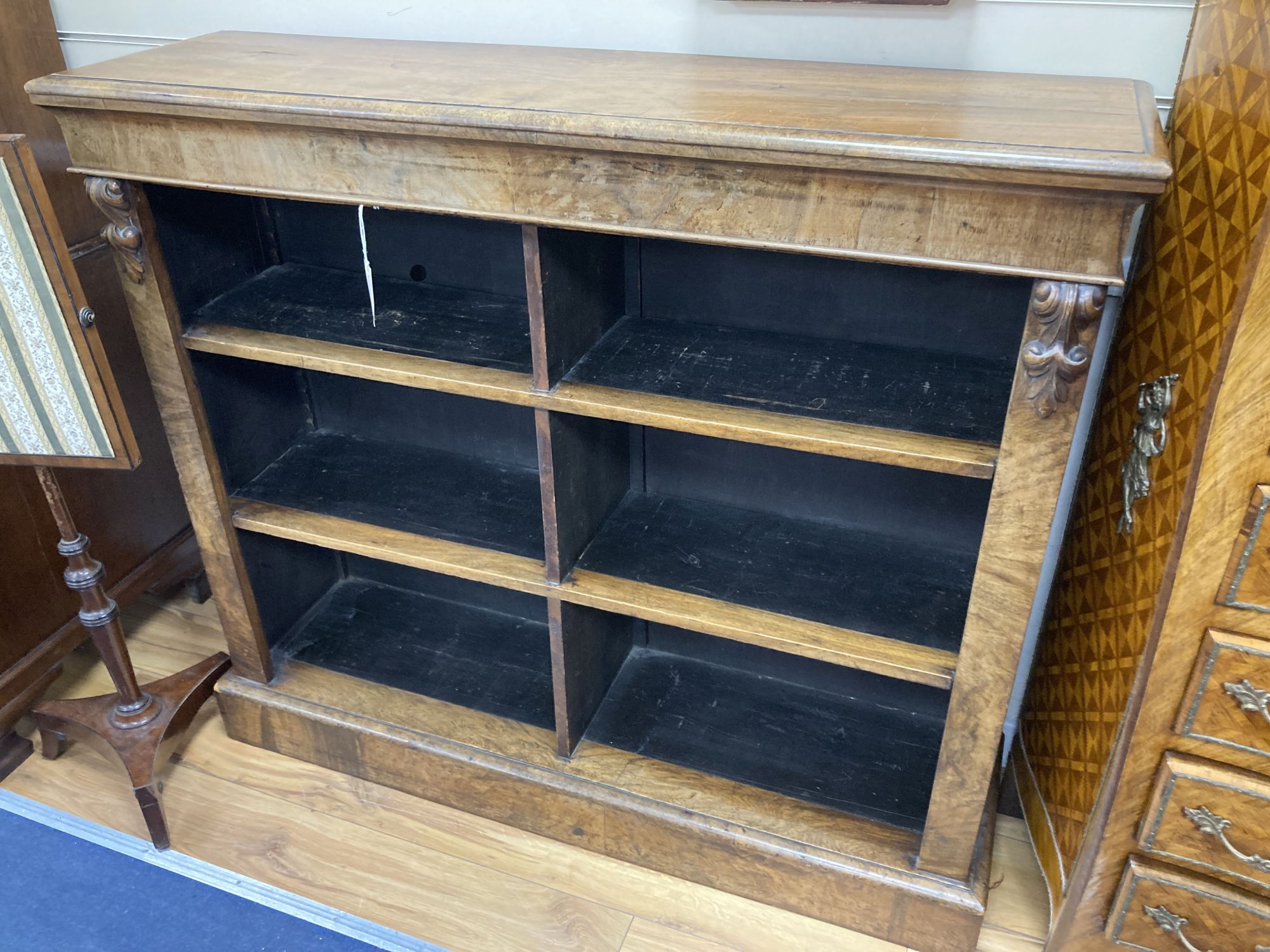 A Victorian walnut open bookcase, length 121cm, depth 34cm, height 107cm