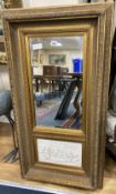 A gilt framed mirror, the base inset with a composition relief depicting putti at play, width