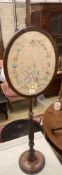 A Victorian mahogany pole screen, with oval tapestry banner, height 128cm