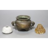 A Chinese bronze and silver inlaid tripod censer, c.1900, a stoneware cover and a crackleglaze