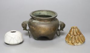 A Chinese bronze and silver inlaid tripod censer, c.1900, a stoneware cover and a crackleglaze
