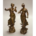 After Moreau. A pair of spelter females, height 31cm