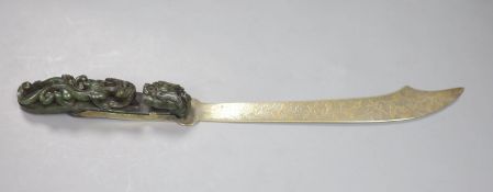 An 18th/19th century Chinese spinach green jadeite 'dragon' belt hook, mounted as the handle for a